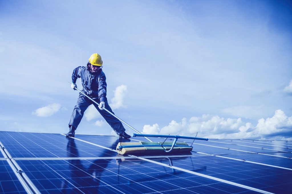 man, solar panel, rooftop-5680696.jpg