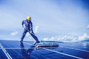 man, solar panel, rooftop-5680696.jpg